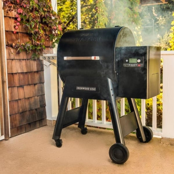 Traeger Ironwood 650 pellet grill being used on deck